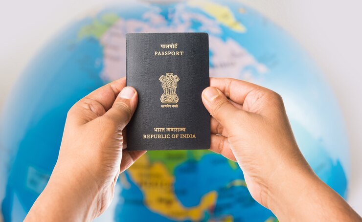 man-holding-indian-passport-white-background-selective-focus_466689-17750